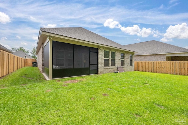 3248 Mountain Laurel Trl, Cantonment, FL 32533 - back of property with brick siding, a sunroom, a fenced backyard, and a shingled roof