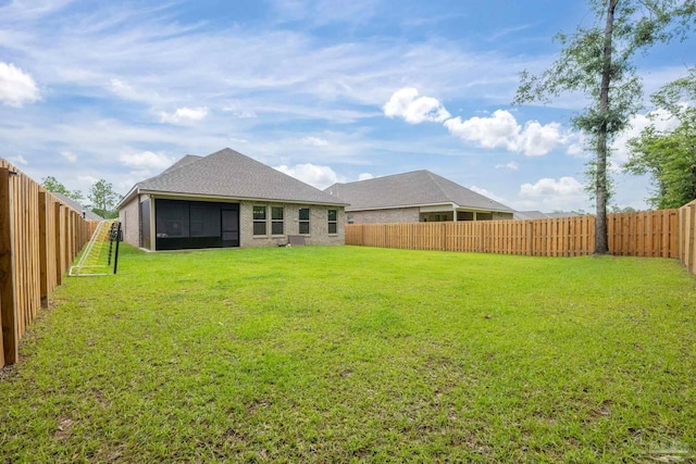 3248 Mountain Laurel Trl, Cantonment, FL 32533 - rear view of house with a sunroom and a fenced backyard