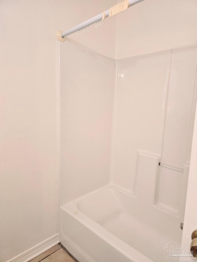 bathroom with tile patterned floors