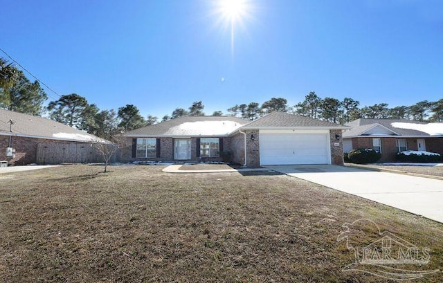 8679 High School Blvd, Navarre, FL 32566 - ranch-style house featuring a garage, driveway, a front lawn, and brick siding