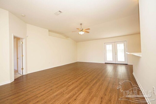 8679 High School Blvd, Navarre, FL 32566 - spare room featuring visible vents, lofted ceiling, ceiling fan, wood finished floors, and french doors