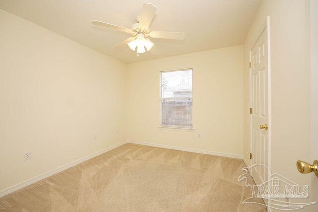 8679 High School Blvd, Navarre, FL 32566 - empty room featuring light carpet, baseboards, and a ceiling fan