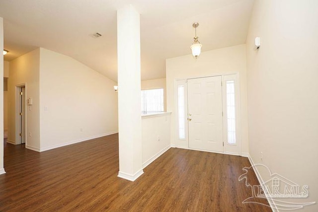 8679 High School Blvd, Navarre, FL 32566 - foyer entrance with vaulted ceiling, wood finished floors, visible vents, and baseboards