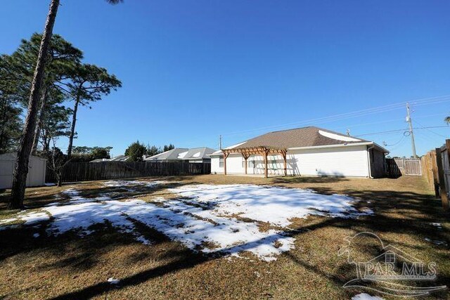 8679 High School Blvd, Navarre, FL 32566 - view of yard with a fenced backyard and a pergola