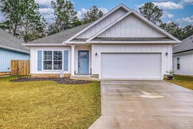 view of front of property featuring a garage and a front yard