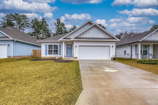 view of front of property featuring a garage and a front yard