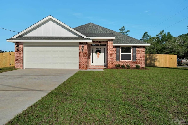 7917 Twin Lake Dr, Milton, FL 32583 - view of front of property with brick siding, an attached garage, concrete driveway, and a shingled roof