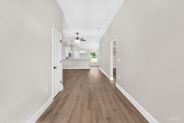 7917 Twin Lake Dr, Milton, FL 32583 - hall featuring light wood-style floors and arched walkways