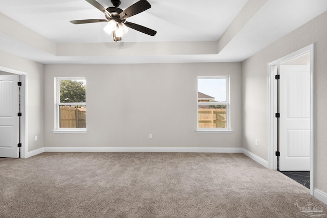 7917 Twin Lake Dr, Milton, FL 32583 - carpeted spare room featuring a ceiling fan and a tray ceiling