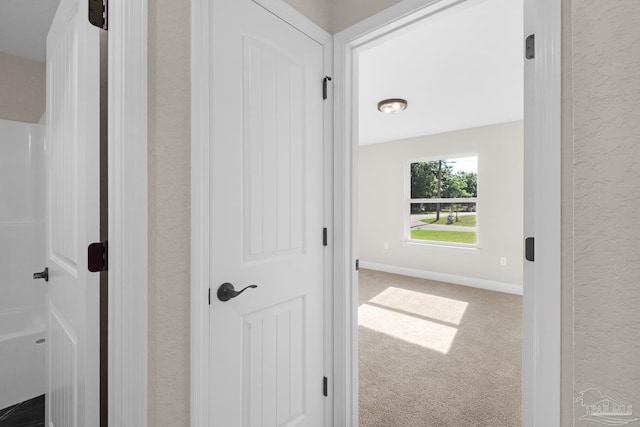 7917 Twin Lake Dr, Milton, FL 32583 - hallway with a textured wall and carpet floors