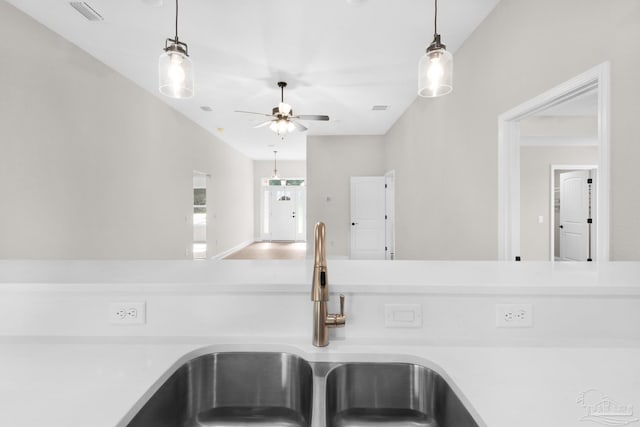 7917 Twin Lake Dr, Milton, FL 32583 - kitchen view of ceiling fan, light countertops, and pendant lighting