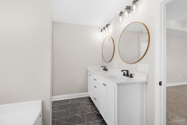 7917 Twin Lake Dr, Milton, FL 32583 - bathroom with double vanity and marble look tiles