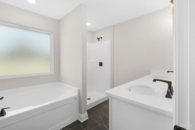 7917 Twin Lake Dr, Milton, FL 32583 - bathroom with marble finish flooring, a garden tub, double vanity, a walk in shower, and recessed lighting