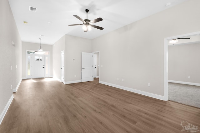 7917 Twin Lake Dr, Milton, FL 32583 - unfurnished living room featuring a ceiling fan and wood finished floors
