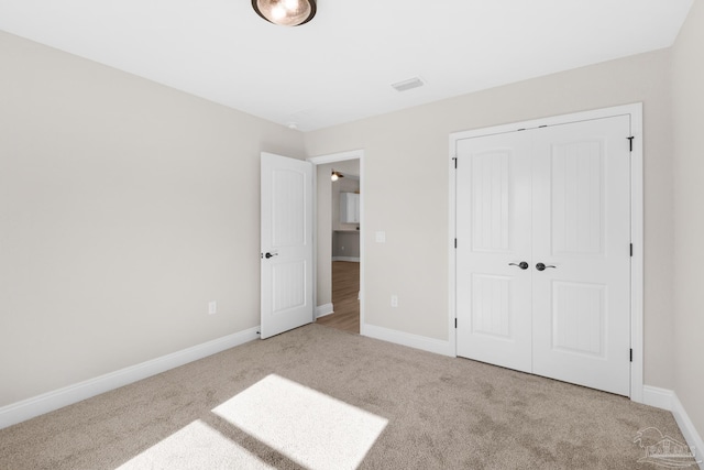 7917 Twin Lake Dr, Milton, FL 32583 - unfurnished bedroom featuring carpet and a closet