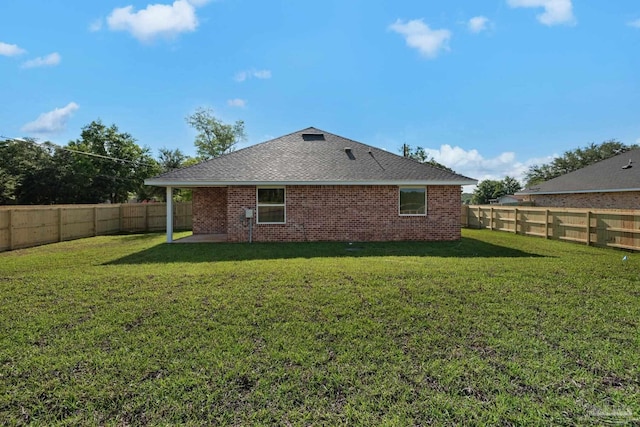7917 Twin Lake Dr, Milton, FL 32583 - rear view of property featuring a patio, a fenced backyard, and roof with shingles