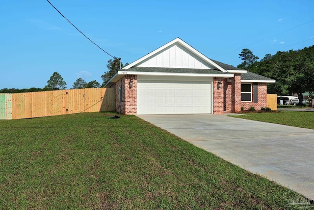 7917 Twin Lake Dr, Milton, FL 32583 - ranch-style home with brick siding, a garage, driveway, and board and batten siding