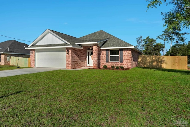 7917 Twin Lake Dr, Milton, FL 32583 - view of front of property featuring brick siding, a garage, concrete driveway, and roof with shingles