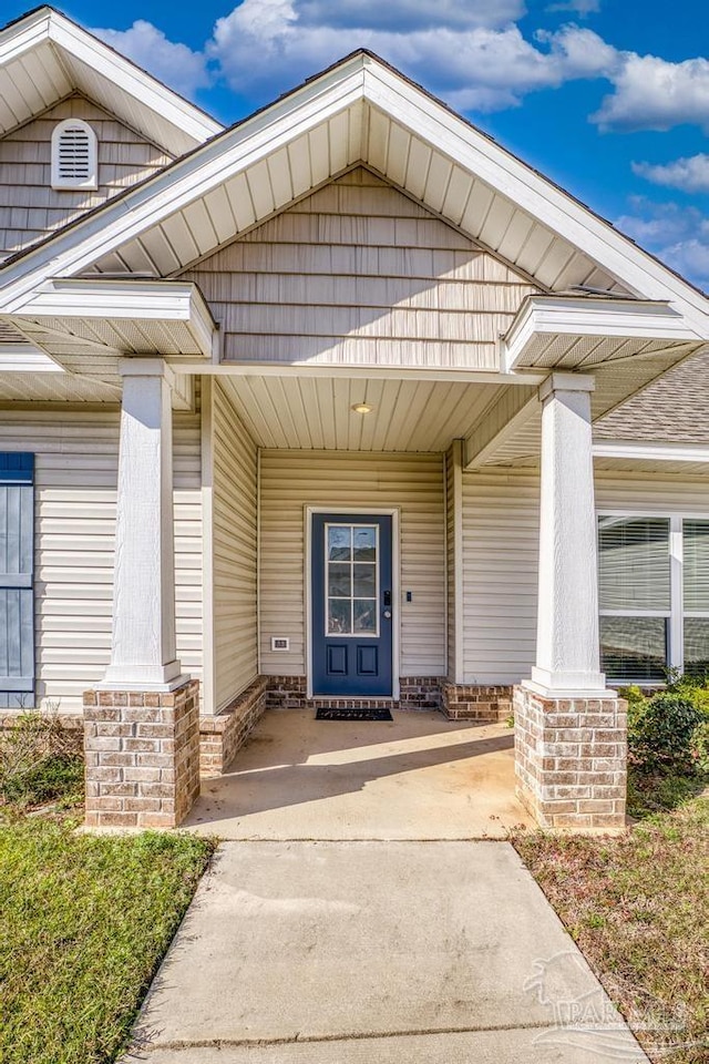 doorway to property with covered porch