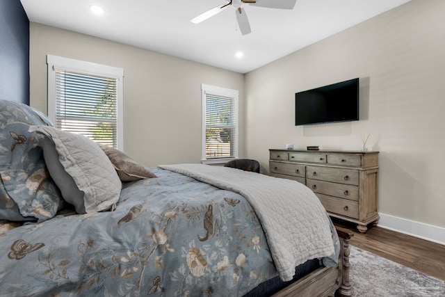 bedroom featuring ceiling fan and dark wood-type flooring