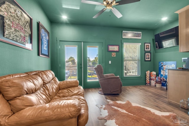 living room with hardwood / wood-style flooring, french doors, ceiling fan, and plenty of natural light