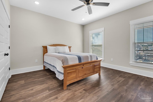 bedroom featuring ceiling fan and dark hardwood / wood-style flooring