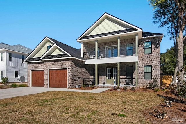 craftsman-style home featuring a balcony, a front yard, a garage, and a porch