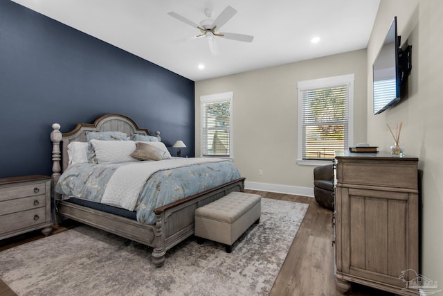 bedroom with hardwood / wood-style floors and ceiling fan