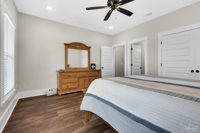 bedroom with ceiling fan and dark wood-type flooring