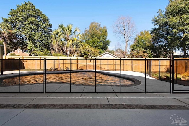 view of gate with a patio area