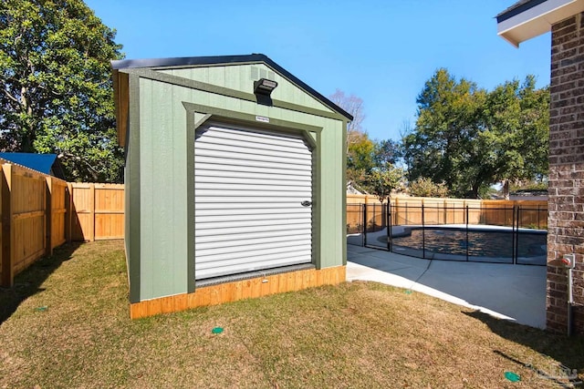 view of outbuilding featuring a lawn