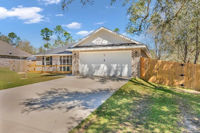 single story home featuring a gate, fence, an attached garage, brick siding, and driveway