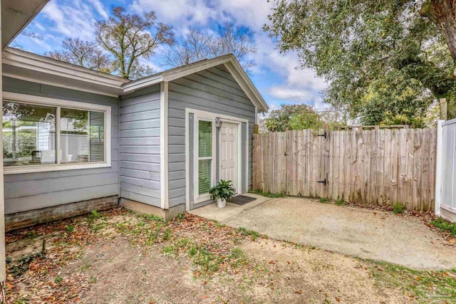 view of outbuilding with fence