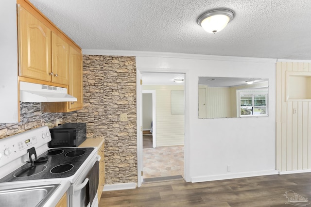 kitchen with dark wood-type flooring, black microwave, under cabinet range hood, light brown cabinetry, and white electric range