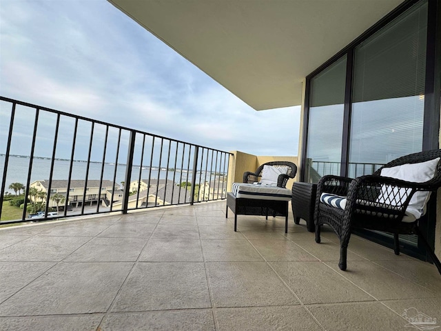 balcony featuring a water view