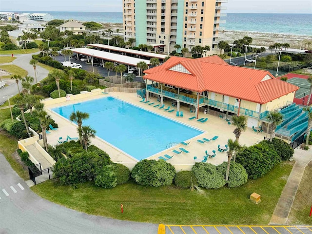 view of swimming pool with a water view