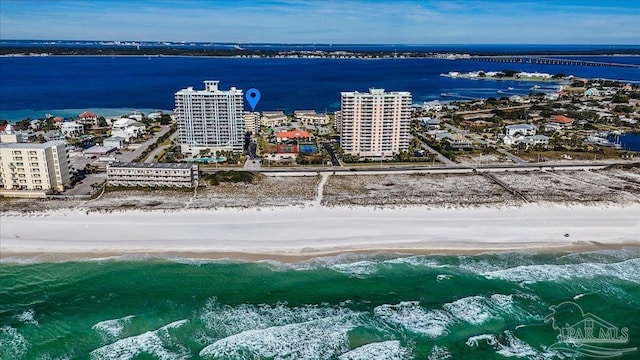 drone / aerial view with a view of the beach and a water view