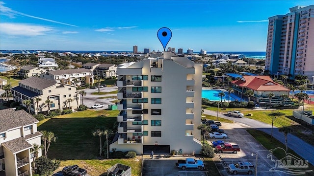 birds eye view of property with a water view