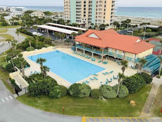 view of swimming pool featuring a water view