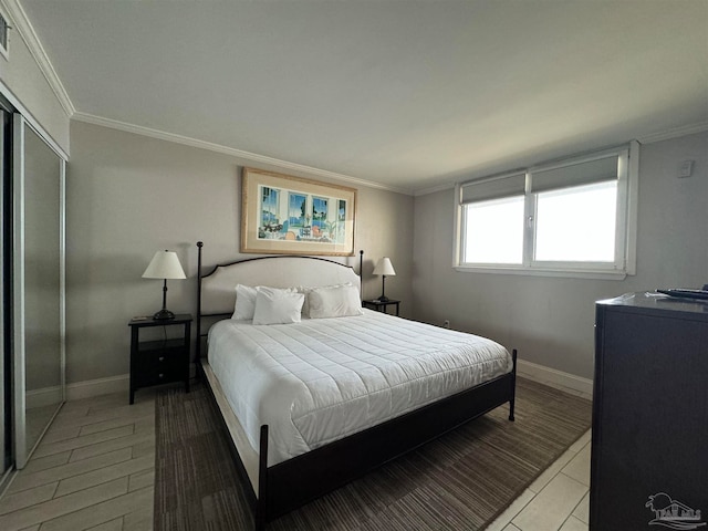 bedroom with light wood-type flooring and ornamental molding