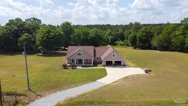 birds eye view of property featuring a view of trees