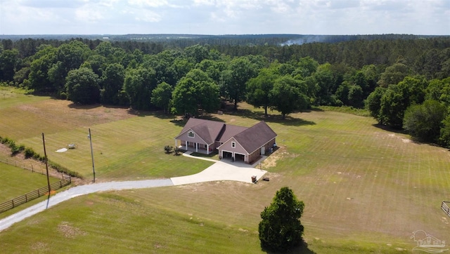 birds eye view of property featuring a rural view and a view of trees