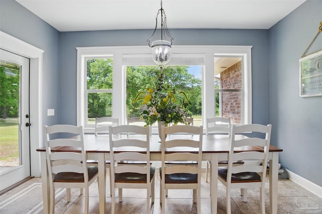dining room with a healthy amount of sunlight and baseboards