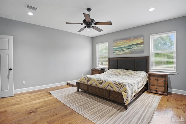 bedroom featuring baseboards, visible vents, light wood-style flooring, and recessed lighting