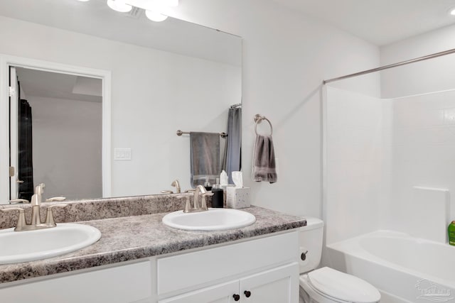 full bathroom with vanity, toilet, and bathtub / shower combination