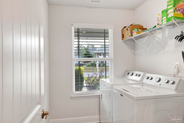 laundry room with a wealth of natural light and separate washer and dryer