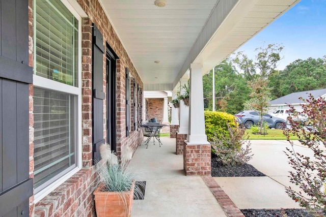 view of patio featuring a porch