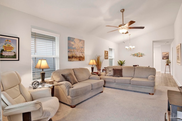 living room with ceiling fan and vaulted ceiling