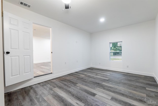 unfurnished room with ceiling fan and dark hardwood / wood-style floors