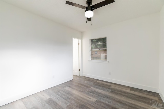 spare room featuring hardwood / wood-style floors and ceiling fan